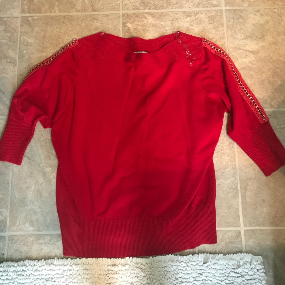 A red dressy and classy women quarter sleeve shirt